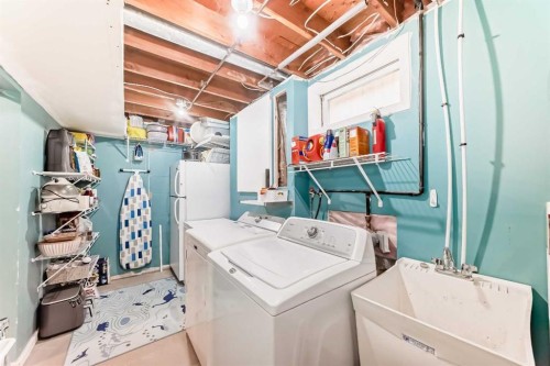 12 Taraglen Road Ne, Calgary, AB - Indoor Photo Showing Laundry Room