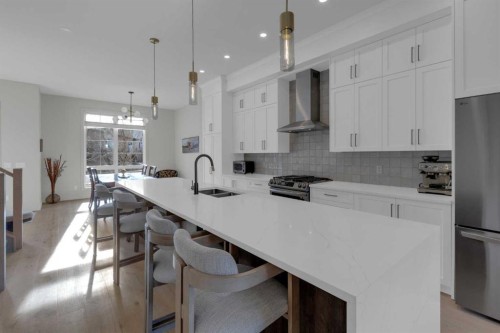7712 36 Avenue Nw, Calgary, AB - Indoor Photo Showing Kitchen With Stainless Steel Kitchen With Double Sink With Upgraded Kitchen