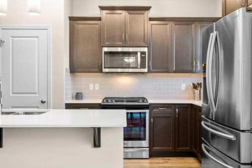 50 Legacy Glen Common Se, Calgary, AB - Indoor Photo Showing Kitchen With Double Sink With Upgraded Kitchen