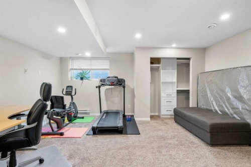 50 Legacy Glen Common Se, Calgary, AB - Indoor Photo Showing Gym Room