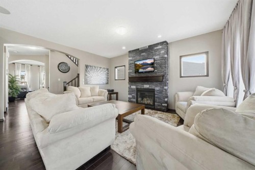 65 Elgin Meadows Circle Se, Calgary, AB - Indoor Photo Showing Living Room With Fireplace