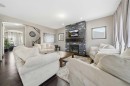 65 Elgin Meadows Circle Se, Calgary, AB  - Indoor Photo Showing Living Room With Fireplace 