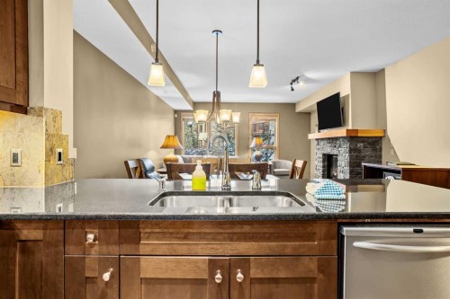 112-379 Spring Creek Drive, Canmore, AB - Indoor Photo Showing Kitchen With Double Sink