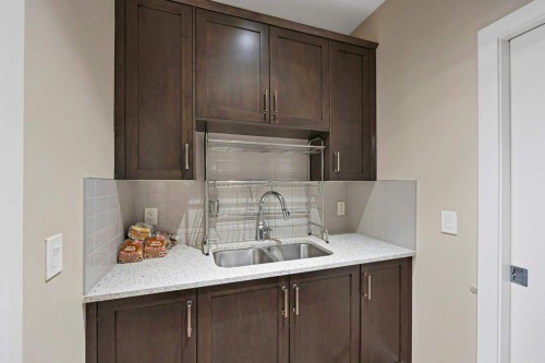 93 Saddlestone Place Ne, Calgary, AB - Indoor Photo Showing Kitchen With Double Sink