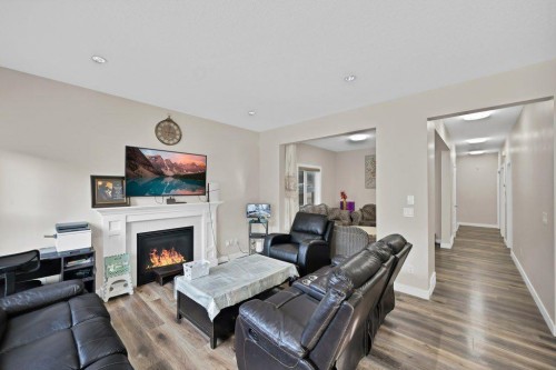 93 Saddlestone Place Ne, Calgary, AB - Indoor Photo Showing Living Room With Fireplace