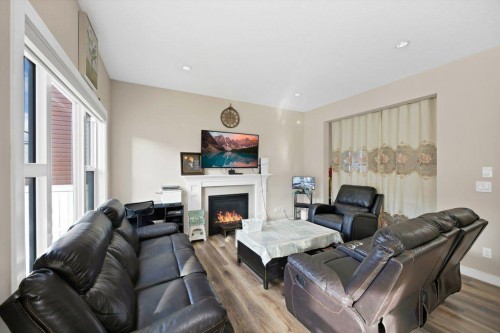 93 Saddlestone Place Ne, Calgary, AB - Indoor Photo Showing Living Room With Fireplace