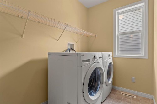 153 Crestridge Way Sw, Calgary, AB - Indoor Photo Showing Laundry Room