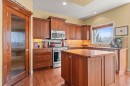 153 Crestridge Way Sw, Calgary, AB  - Indoor Photo Showing Kitchen With Double Sink 