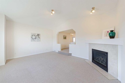 320 Citadel Meadow Bay Nw, Calgary, AB - Indoor Photo Showing Living Room With Fireplace