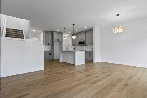 90 Heritage Circle, Cochrane, AB - Indoor Photo Showing Kitchen With Upgraded Kitchen