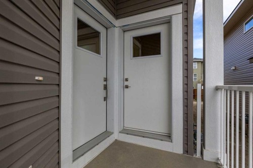 90 Heritage Circle, Cochrane, AB - Outdoor With Exterior