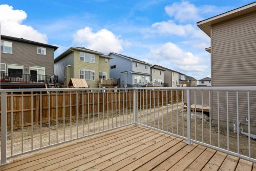 90 Heritage Circle, Cochrane, AB - Outdoor With Deck Patio Veranda With Exterior