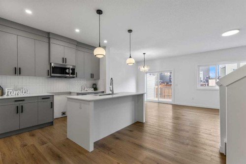 90 Heritage Circle, Cochrane, AB - Indoor Photo Showing Kitchen With Upgraded Kitchen