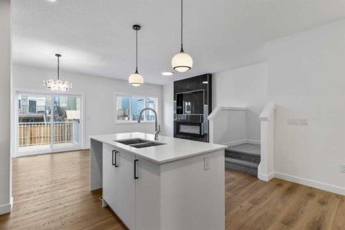 90 Heritage Circle, Cochrane, AB - Indoor Photo Showing Kitchen With Double Sink With Upgraded Kitchen