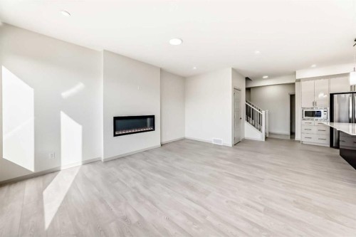 31 Lucas Passage Nw, Calgary, AB - Indoor With Fireplace