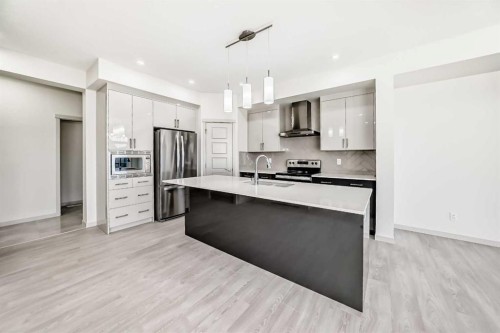 31 Lucas Passage Nw, Calgary, AB - Indoor Photo Showing Kitchen With Upgraded Kitchen