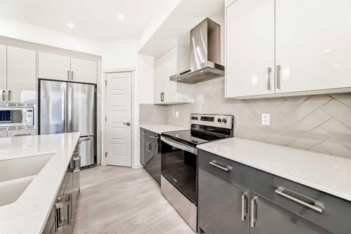 31 Lucas Passage Nw, Calgary, AB - Indoor Photo Showing Kitchen With Upgraded Kitchen