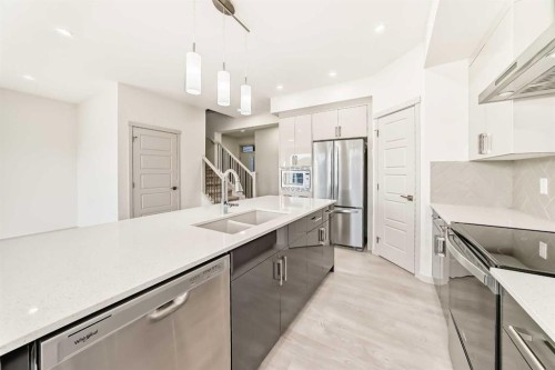 31 Lucas Passage Nw, Calgary, AB - Indoor Photo Showing Kitchen With Double Sink With Upgraded Kitchen