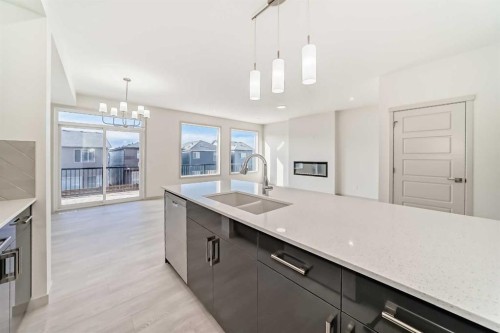 31 Lucas Passage Nw, Calgary, AB - Indoor Photo Showing Kitchen With Double Sink With Upgraded Kitchen