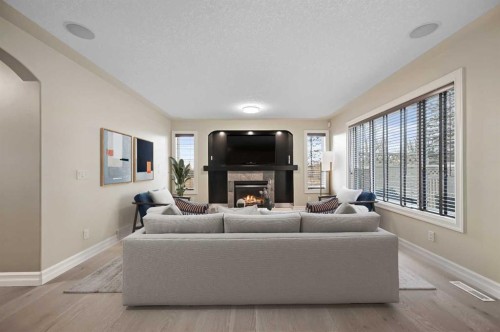 5619 Coach Hill Road Sw, Calgary, AB - Indoor Photo Showing Living Room With Fireplace