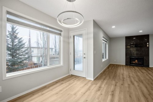 104 Cove Crescent, Chestermere, AB - Indoor Photo Showing Other Room With Fireplace
