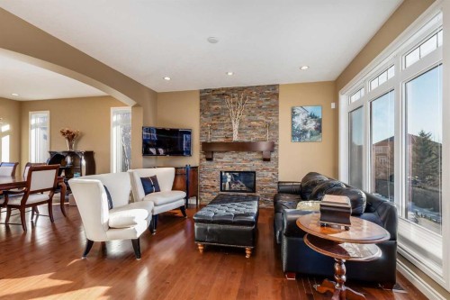 213 Silverado Ranch Manor Sw, Calgary, AB - Indoor Photo Showing Living Room With Fireplace