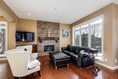 213 Silverado Ranch Manor Sw, Calgary, AB - Indoor Photo Showing Living Room With Fireplace