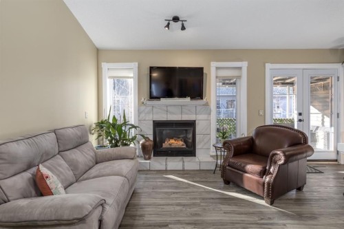 321 De Foras Close Nw, High River, AB - Indoor Photo Showing Living Room With Fireplace