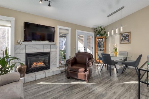 321 De Foras Close Nw, High River, AB - Indoor Photo Showing Living Room With Fireplace