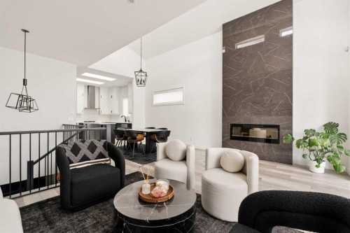 103 Haskayne Drive Nw, Calgary, AB - Indoor Photo Showing Living Room With Fireplace