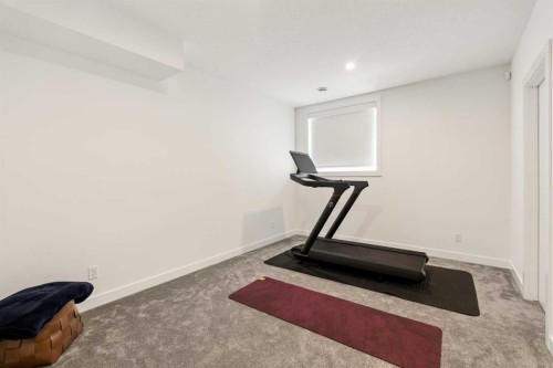 103 Haskayne Drive Nw, Calgary, AB - Indoor Photo Showing Gym Room