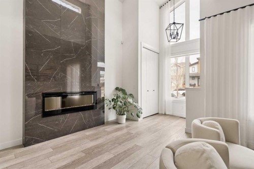 103 Haskayne Drive Nw, Calgary, AB - Indoor With Fireplace