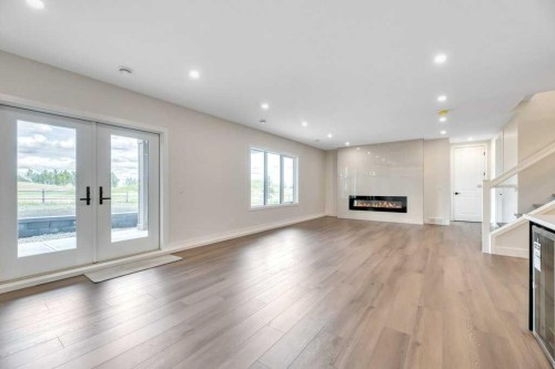 158 Speargrass Crescent, Carseland, AB - Indoor Photo Showing Other Room With Fireplace