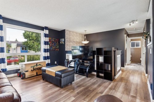 147 Falchurch Crescent Ne, Calgary, AB - Indoor Photo Showing Living Room
