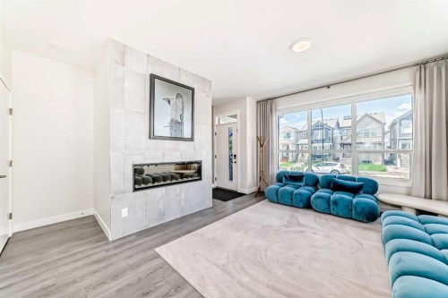 38 Lavender Road Se, Calgary, AB - Indoor Photo Showing Living Room With Fireplace