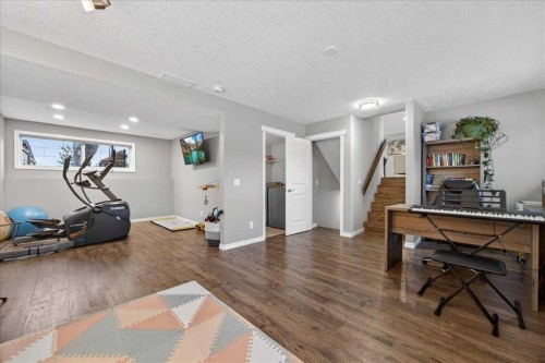 102 Hodson Crescent, Okotoks, AB - Indoor Photo Showing Gym Room