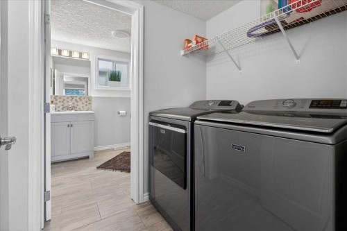 102 Hodson Crescent, Okotoks, AB - Indoor Photo Showing Laundry Room