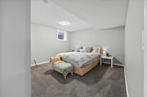 102 Hodson Crescent, Okotoks, AB - Indoor Photo Showing Bedroom