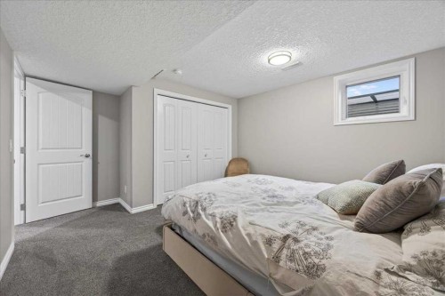 102 Hodson Crescent, Okotoks, AB - Indoor Photo Showing Bedroom