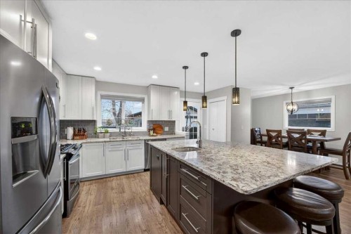 102 Hodson Crescent, Okotoks, AB - Indoor Photo Showing Kitchen With Upgraded Kitchen
