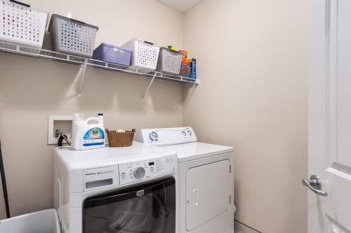 128 Seagreen Manor, Chestermere, AB - Indoor Photo Showing Laundry Room