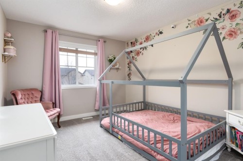 128 Seagreen Manor, Chestermere, AB - Indoor Photo Showing Bedroom