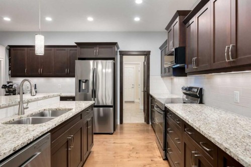 2050 High Country Rise, High River, AB - Indoor Photo Showing Kitchen With Double Sink With Upgraded Kitchen
