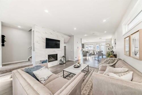 159 Evanscrest Park Nw, Calgary, AB - Indoor Photo Showing Living Room With Fireplace