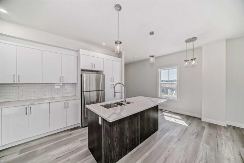 72-351 Monteith Drive Se, High River, AB - Indoor Photo Showing Kitchen With Double Sink With Upgraded Kitchen