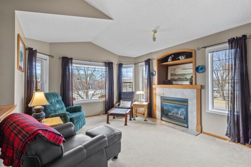 161 West Lakeview Drive, Chestermere, AB - Indoor Photo Showing Living Room With Fireplace