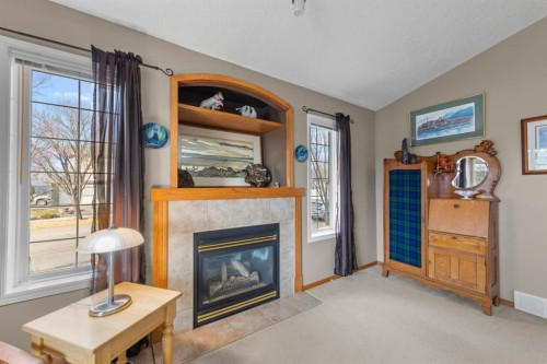 161 West Lakeview Drive, Chestermere, AB - Indoor Photo Showing Living Room With Fireplace