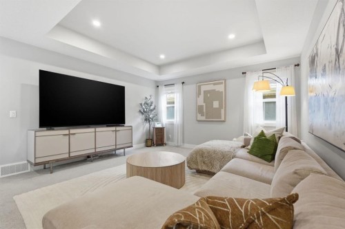 19 Masters Green Se, Calgary, AB - Indoor Photo Showing Living Room