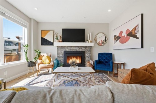 19 Masters Green Se, Calgary, AB - Indoor Photo Showing Living Room With Fireplace