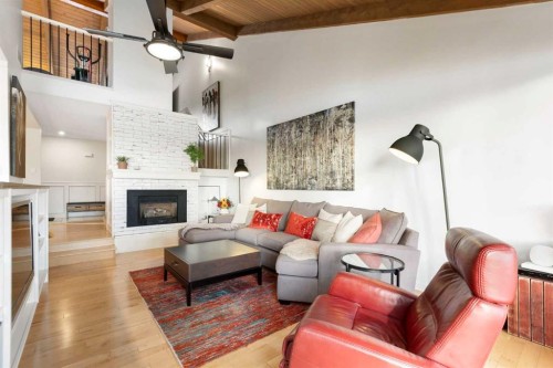 825-860 Midridge Drive Se, Calgary, AB - Indoor Photo Showing Living Room With Fireplace